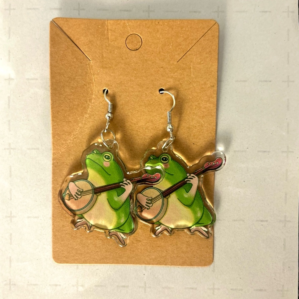 Frog playing banjo dangling earrings